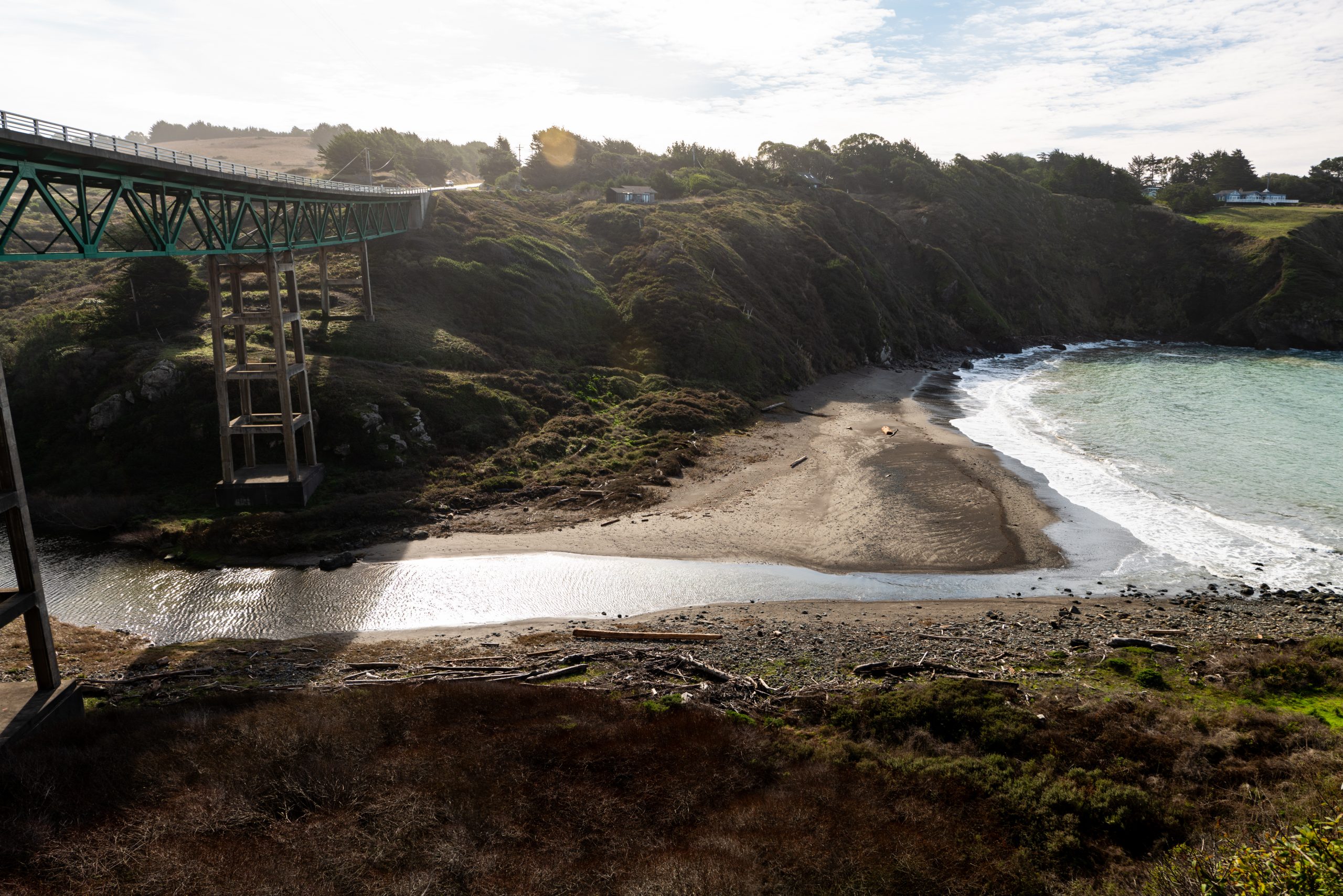 Bridge over ravine with stream leading to ocean below in Albion Ca.