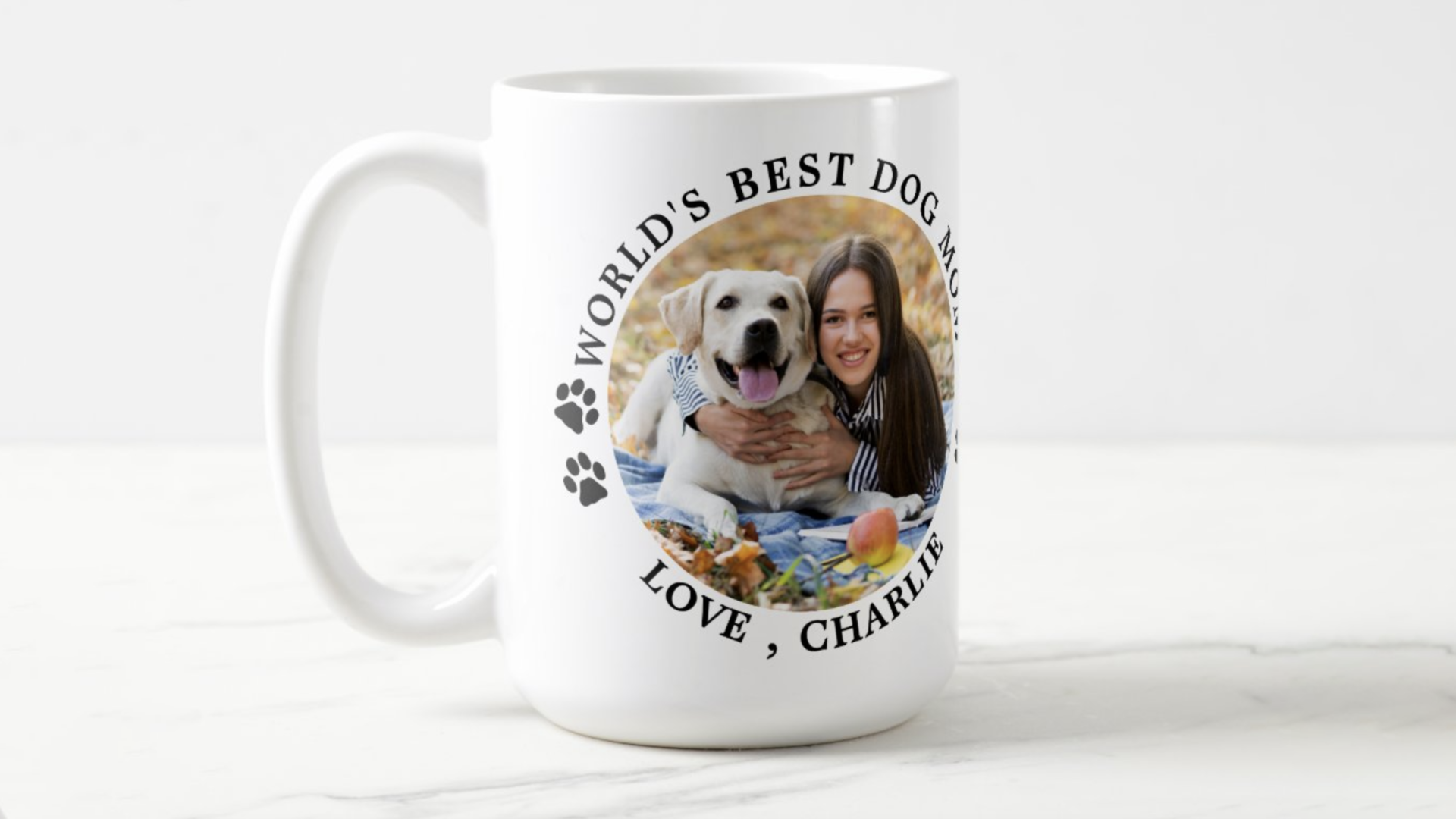Dog and person on coffee cup