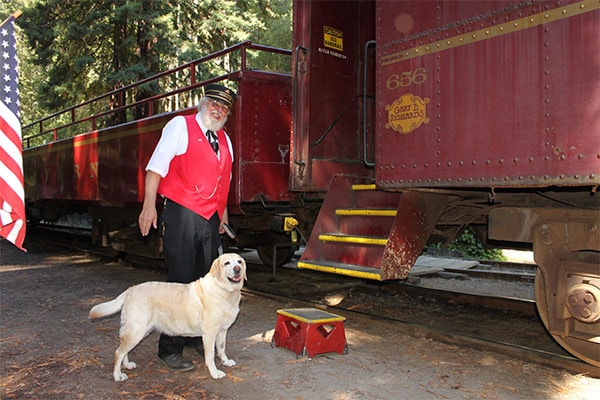 Kayla and Chuck the conductor boarding the Skunk Train