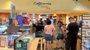 visitors inside gift shop area of Mammoth Lakes Welcome Center
