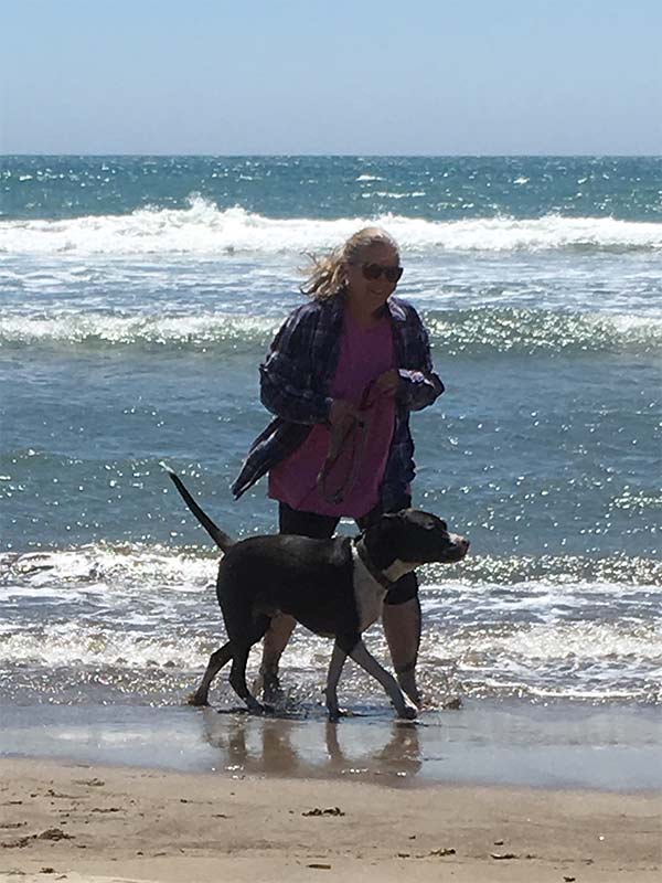 Riggs and person at the ocean