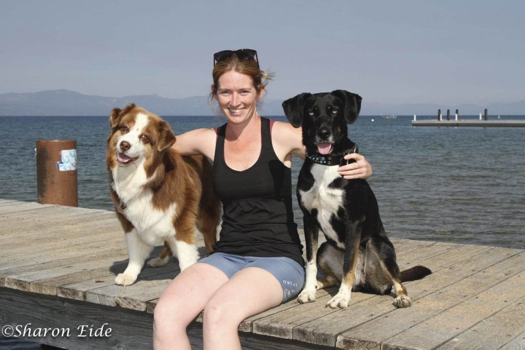 Two dogs and woman in Tahoe