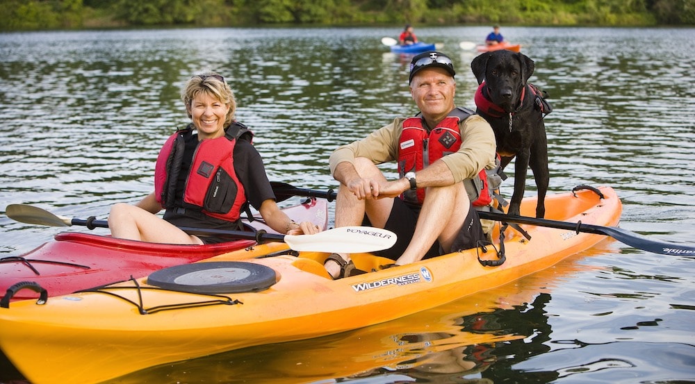 People and dog on kayak in Folsom