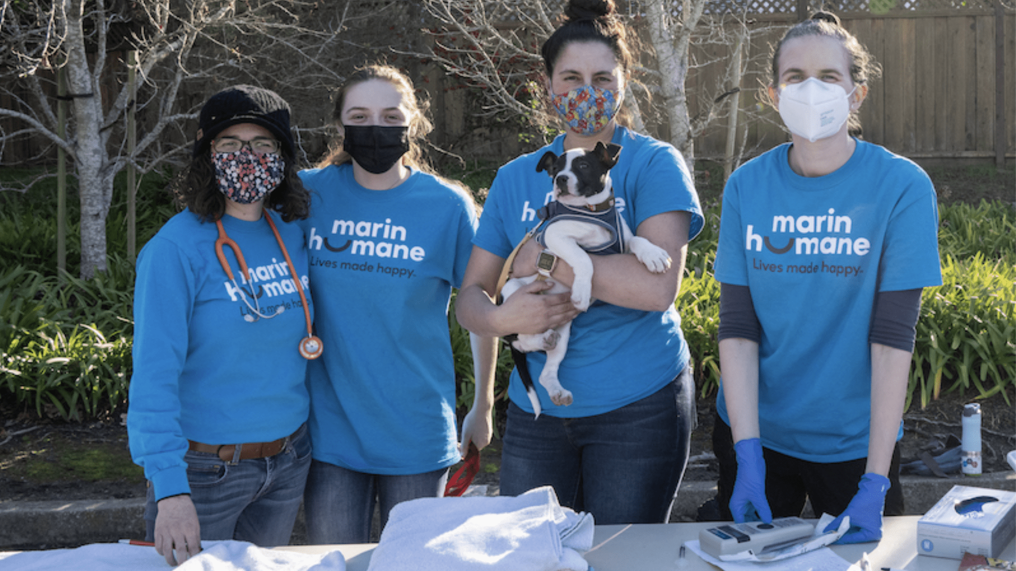 Person holding dog at Marin Humane Society event