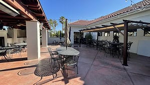 tables and chairs on patio at Crest Bar and Grill