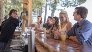 patrons sit at outdoor bar