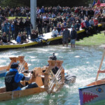 boaters in handmade wooden boats