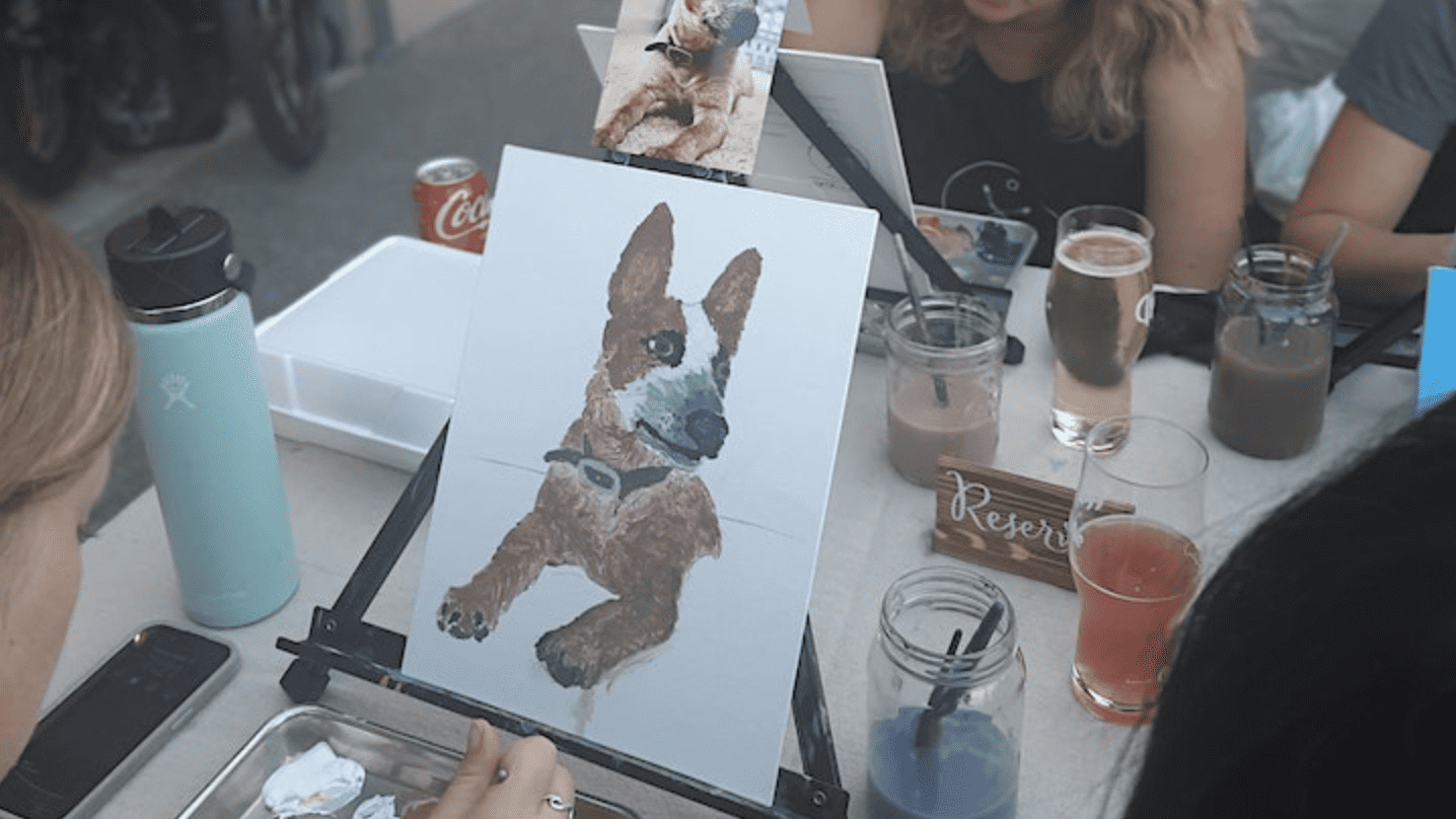 person painting portrait of a dog