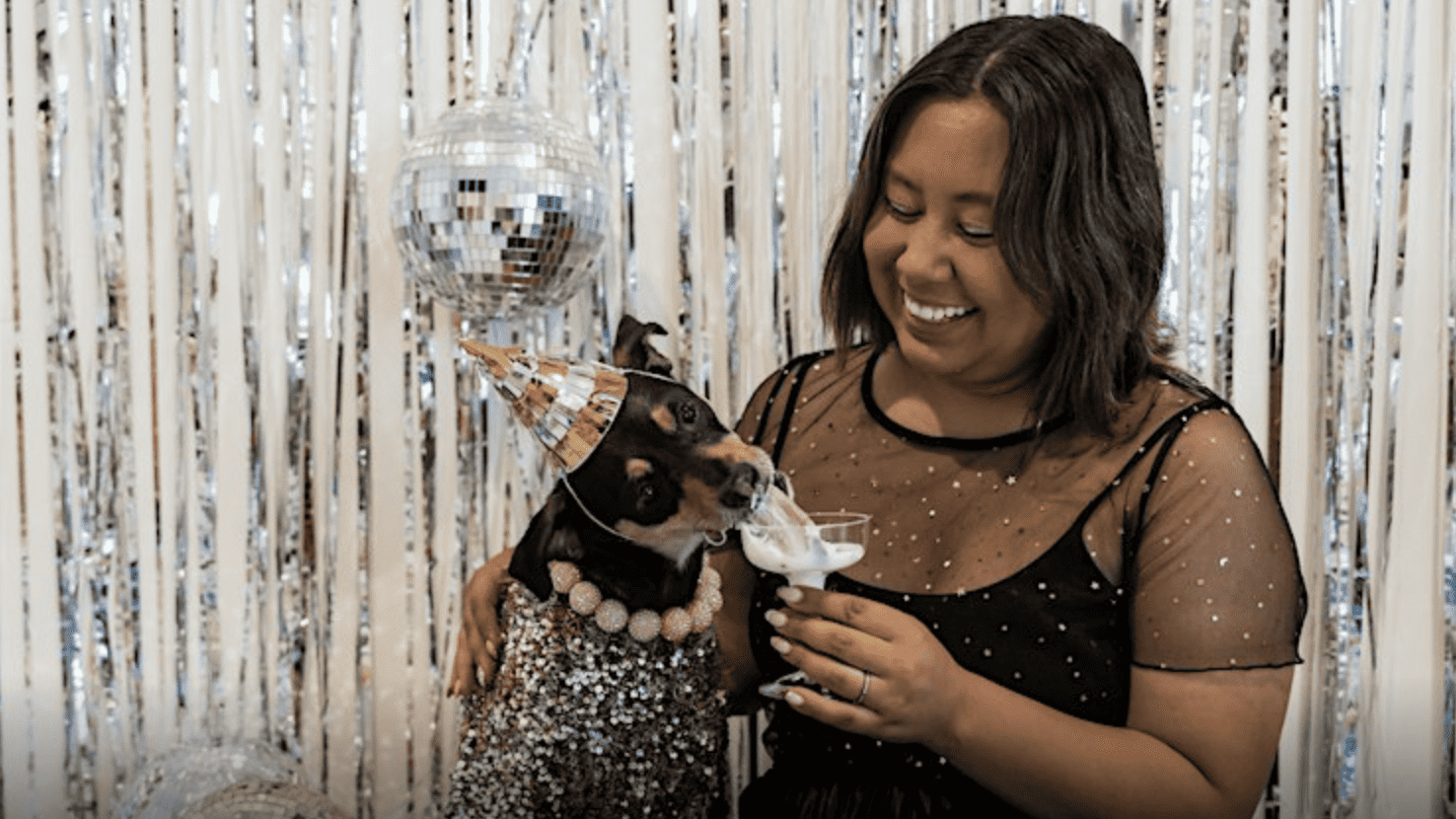 dog drinking pup cup with woman