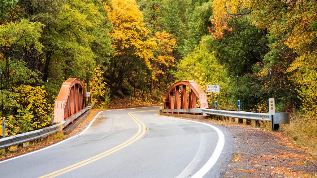 California State Route 32 Bridge at Deer Creek in Tehama County California USA on an autumn day.