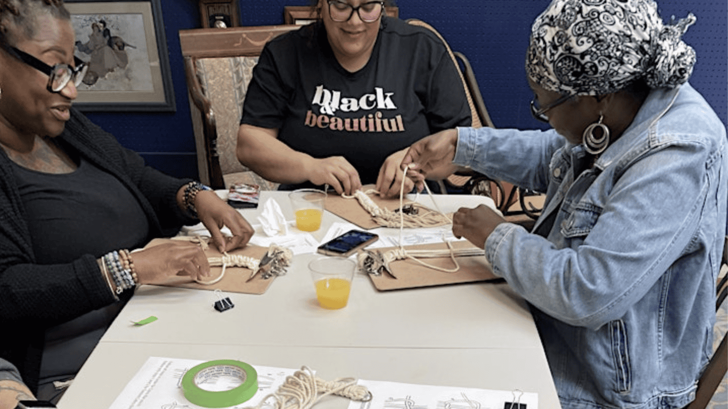 Three dog-lovers were engaged in a fun-filled craft session.