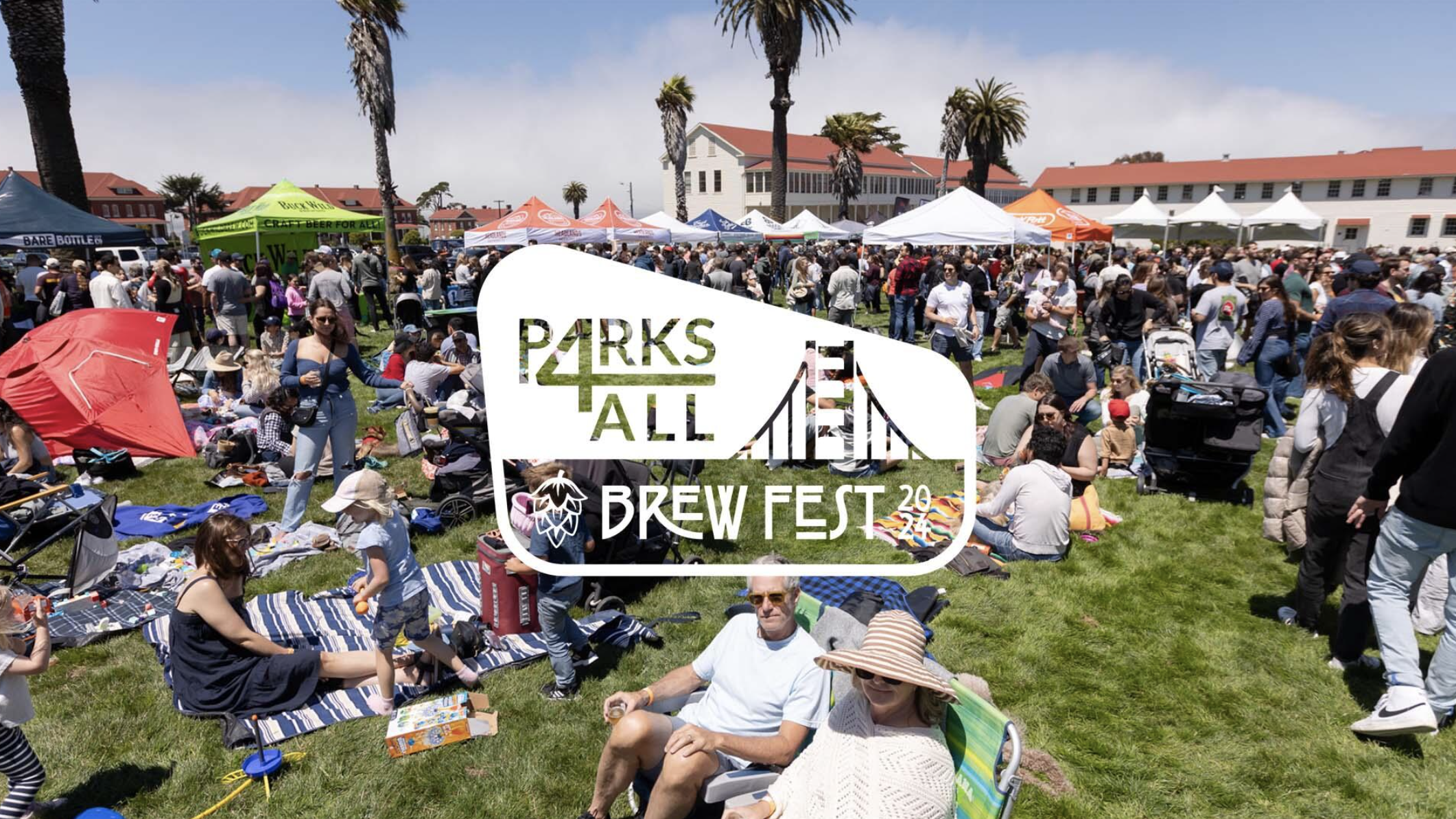 Visitors gather at the Parks4All Brewfest 29, engaging in various outdoor activities. Some attendees relax on blankets and chairs, chatting near the vendor tents. Palm trees and historic buildings form a backdrop under clear skies, enhancing the lively ambiance.