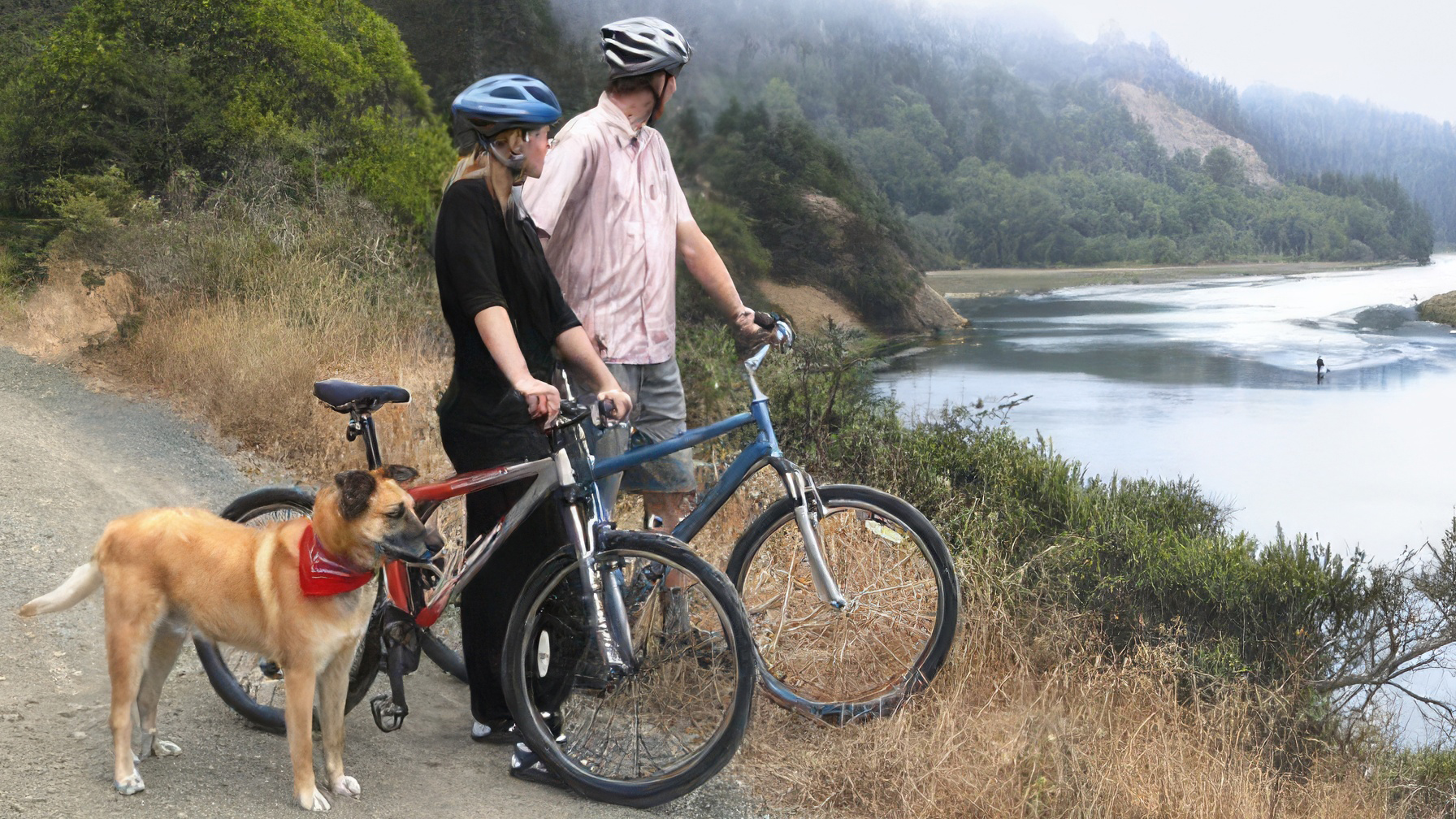 Two cyclists in helmets stand next to their bicycles on a dirt path, gazing at a calm body of water flanked by hills and trees. A dog with a red bandana sits beside them. Light fog drifts over the hilltops near the Stanford Inn, creating a peaceful atmosphere.