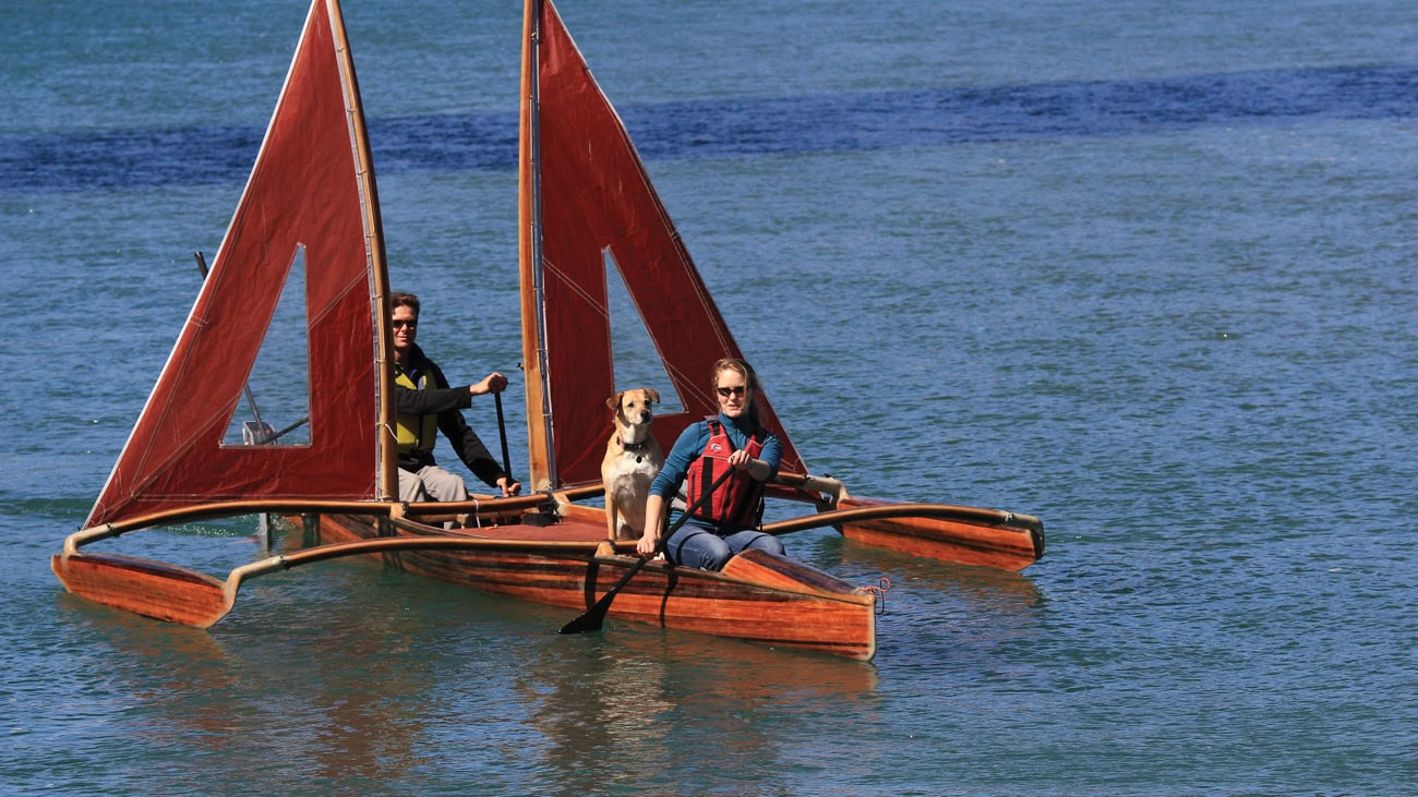 Dog and people on outrigger canoe story