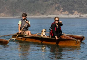 Dog and people in an outrigger