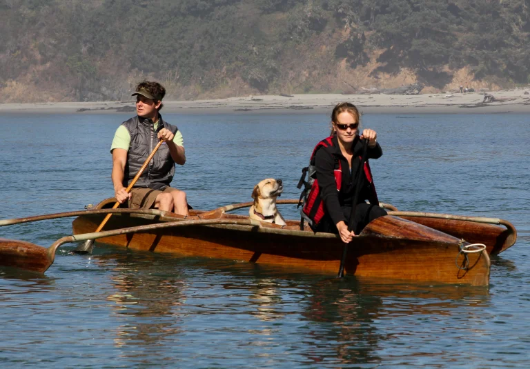 Dog and people in an outrigger