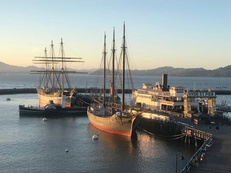 Several historic ships docked to Hyde Street Pier