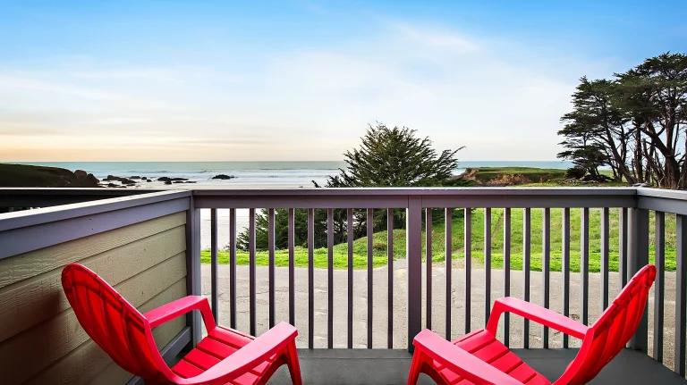 Beachcomber Motel balcony chairs facing ocean