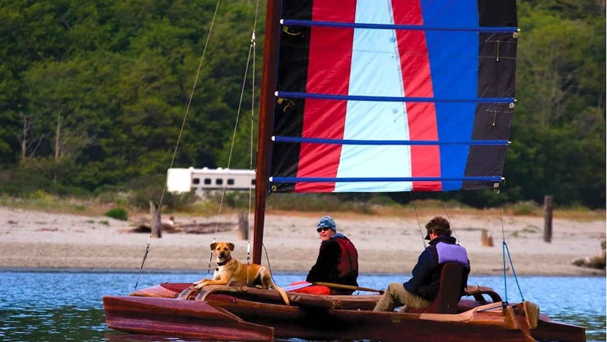 Catch A Canoe dog on outrigger